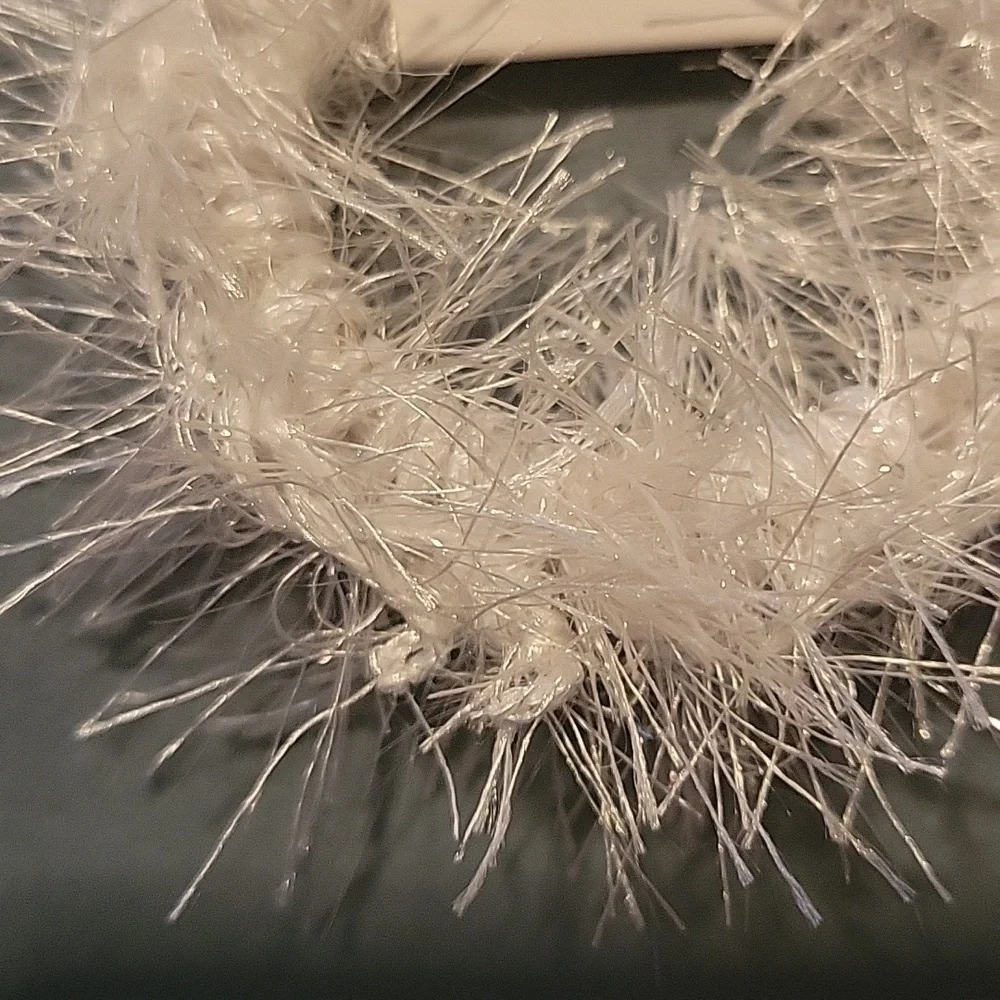 Hair tie made with white eyelash yarn.  Scrunchie  Nwt.